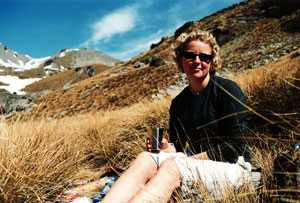 Caroline sitting in the tussocks in the South Island high country, 2002. 
