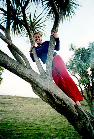 Caroline up at cabbage tree at the family farm Te Kouka