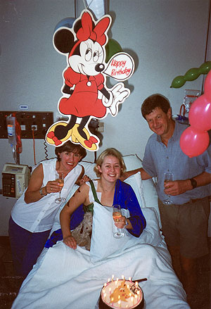 Caroline celebrating her 21st birthday with her parents. 